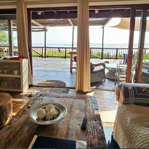 Step into paradise! Our large lounge opens out to breath-taking 180-degree sea views through grand double doors, leading to an expansive veranda where the sea view is a masterpiece.