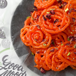 Fresh Jalebis topped with pistachios, rose petals & saffron
